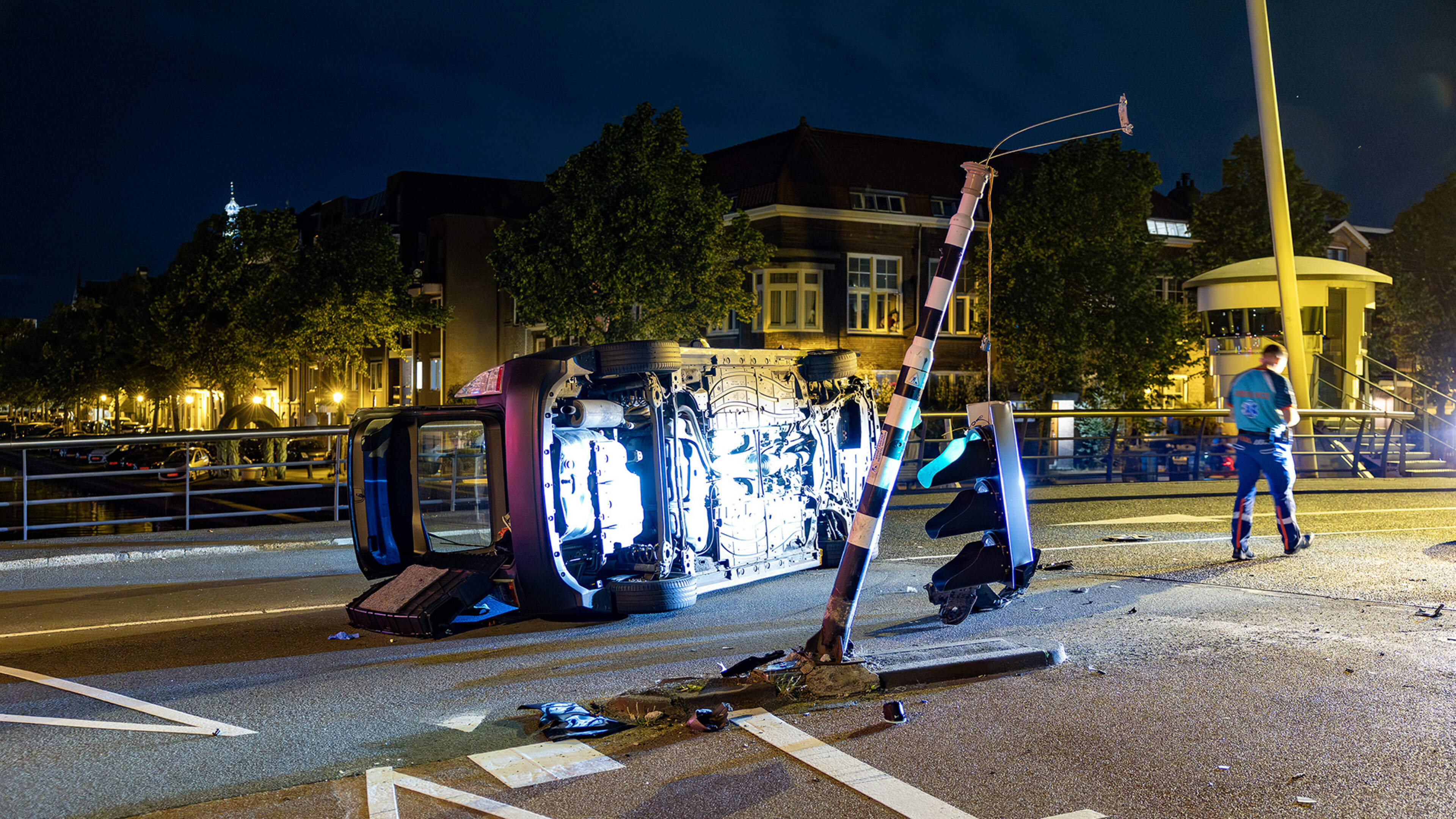 Car ends up on its side in Haarlem, driver taken to hospital