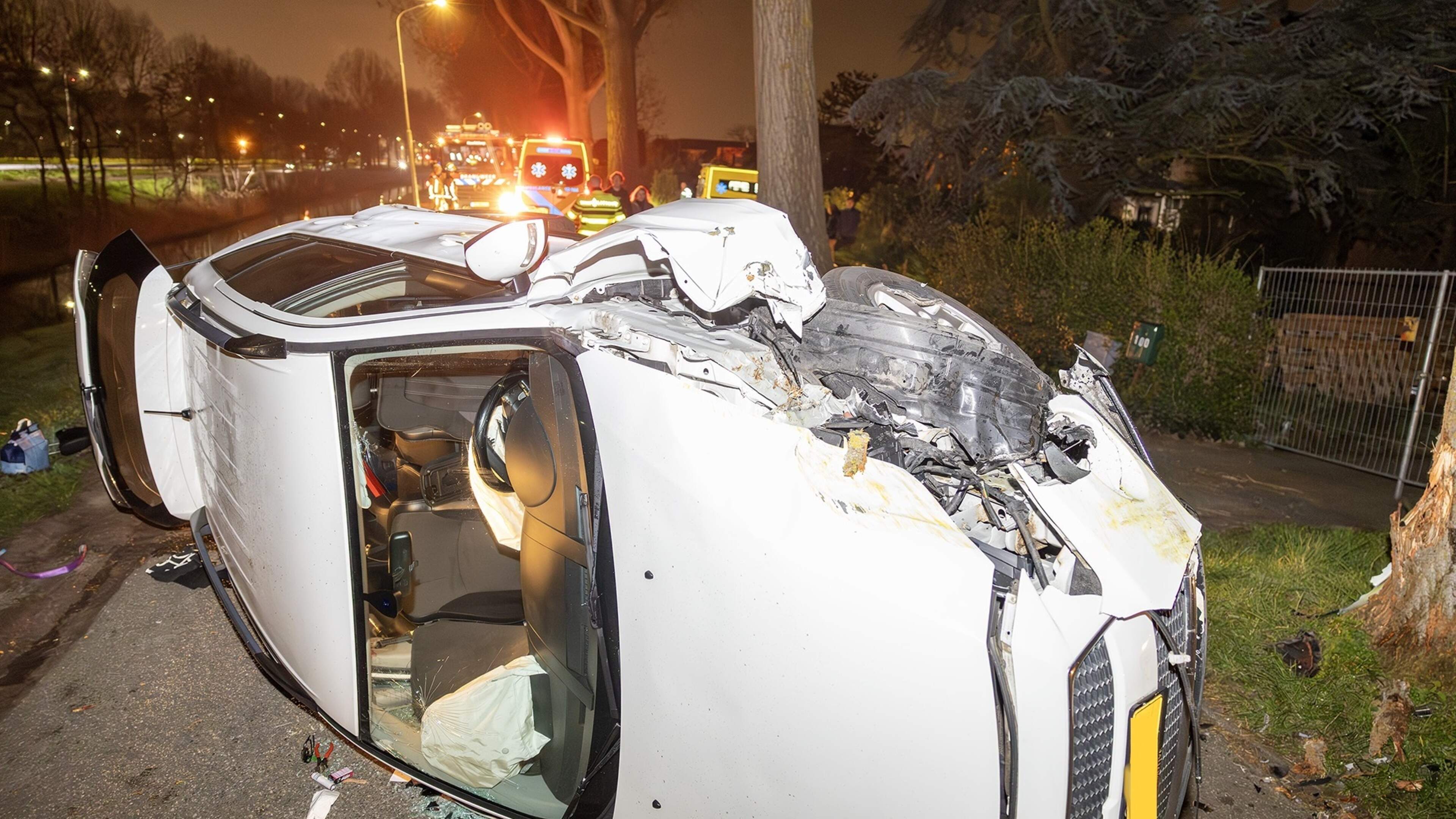 Car on its side after crashing into tree in Cruquius, driver taken to hospital