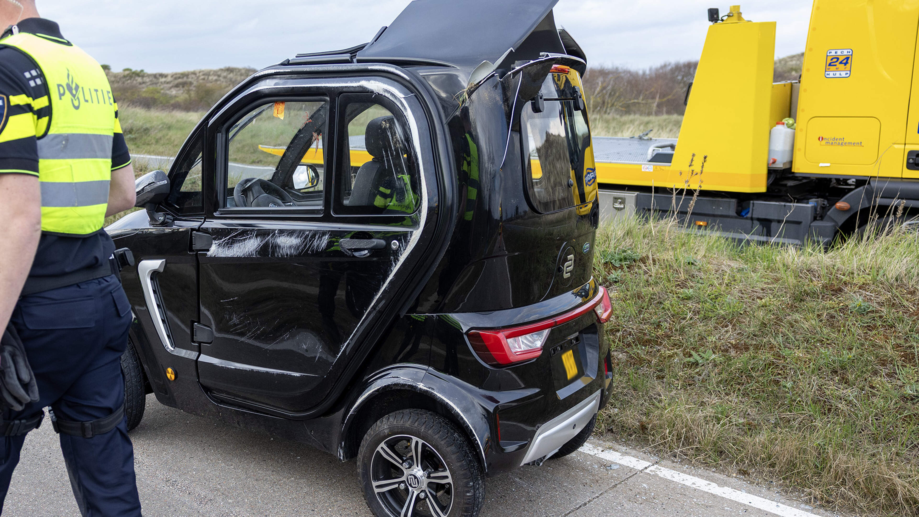 Microcar flips on its side in accident on Zeeweg in Overveen, occupant taken to hospital